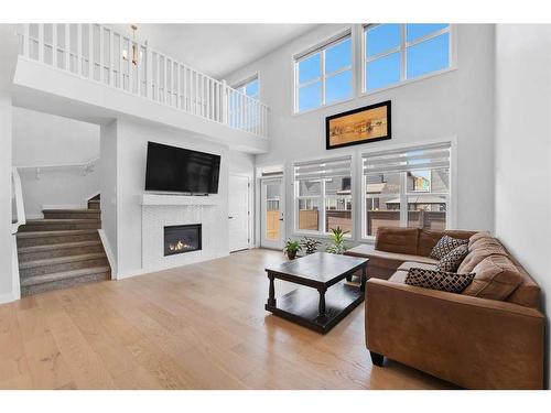 291 Seton Road Se, Calgary, AB - Indoor Photo Showing Living Room With Fireplace