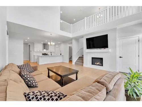 291 Seton Road Se, Calgary, AB - Indoor Photo Showing Living Room With Fireplace