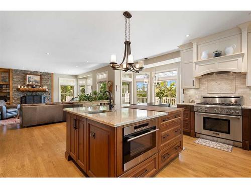 43 Cody Range Way, Rural Rocky View County, AB - Indoor Photo Showing Kitchen With Fireplace With Upgraded Kitchen