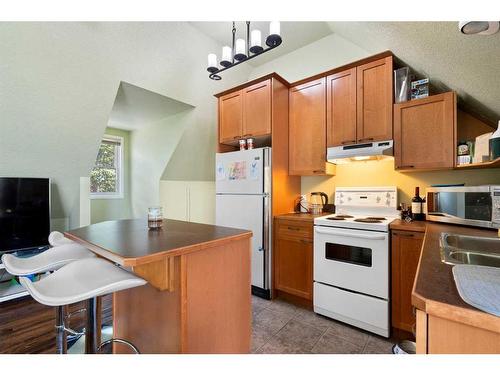 43 Cody Range Way, Rural Rocky View County, AB - Indoor Photo Showing Kitchen With Double Sink