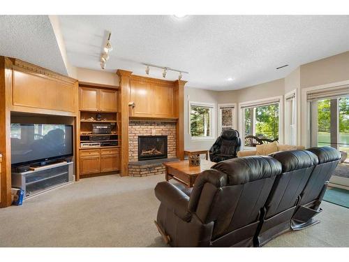 43 Cody Range Way, Rural Rocky View County, AB - Indoor Photo Showing Living Room With Fireplace