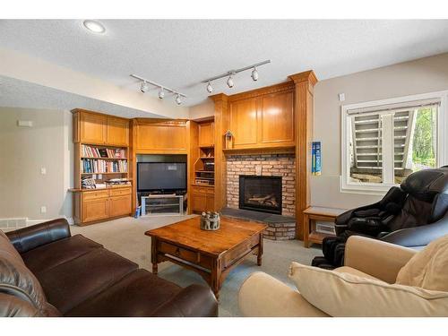 43 Cody Range Way, Rural Rocky View County, AB - Indoor Photo Showing Living Room With Fireplace