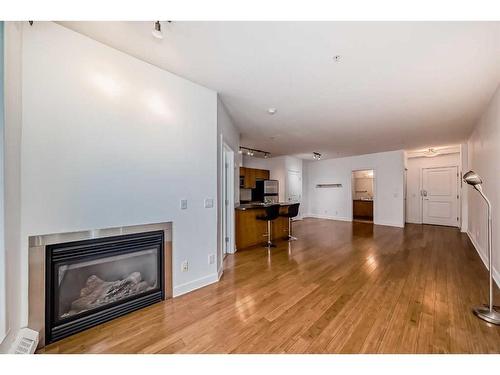 311-328 21 Avenue Sw, Calgary, AB - Indoor Photo Showing Living Room With Fireplace