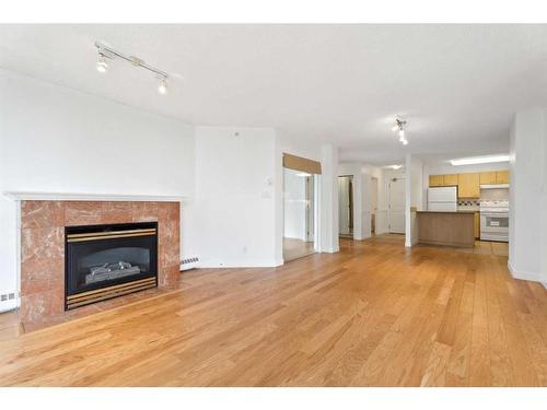 710-804 3 Avenue Sw, Calgary, AB - Indoor Photo Showing Living Room With Fireplace