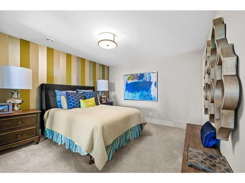 18 Whispering Springs Way, Heritage Pointe, AB - Indoor Photo Showing Bedroom