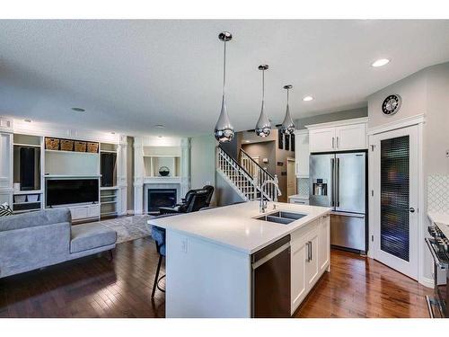 133 Kincora Place Nw, Calgary, AB - Indoor Photo Showing Kitchen With Fireplace With Stainless Steel Kitchen With Double Sink With Upgraded Kitchen