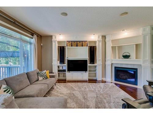 133 Kincora Place Nw, Calgary, AB - Indoor Photo Showing Living Room With Fireplace