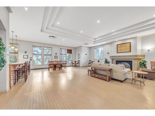 212-3650 Marda Link Sw, Calgary, AB - Indoor Photo Showing Living Room With Fireplace