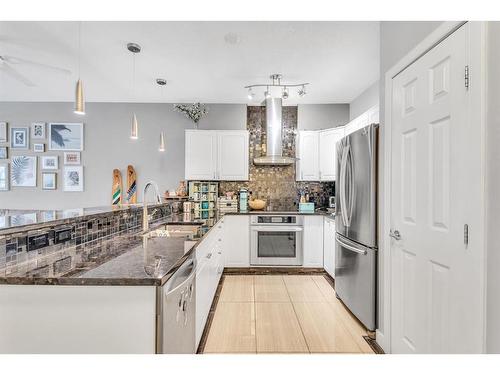 212-3650 Marda Link Sw, Calgary, AB - Indoor Photo Showing Kitchen With Stainless Steel Kitchen With Upgraded Kitchen