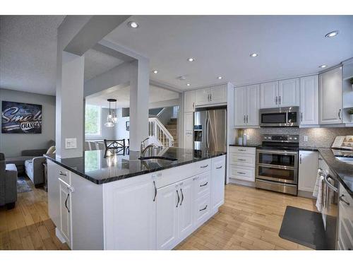15 Strathaven Circle Sw, Calgary, AB - Indoor Photo Showing Kitchen With Upgraded Kitchen