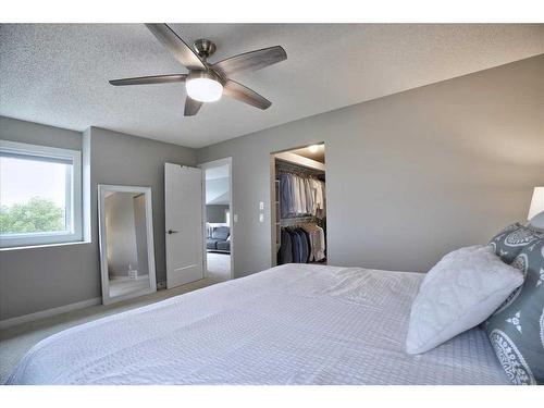 15 Strathaven Circle Sw, Calgary, AB - Indoor Photo Showing Bedroom