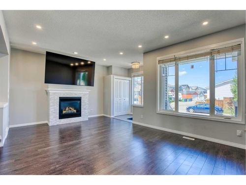420 Auburn Crest Way Se, Calgary, AB - Indoor Photo Showing Living Room With Fireplace