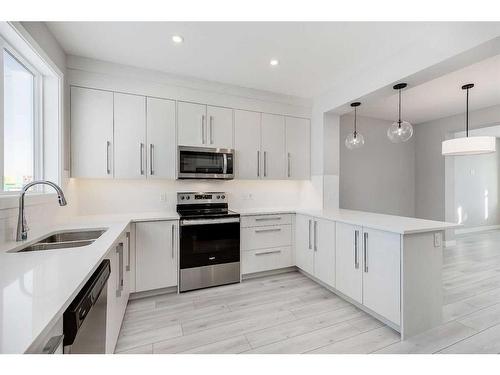 121 Dawson Circle, Chestermere, AB - Indoor Photo Showing Kitchen With Double Sink With Upgraded Kitchen