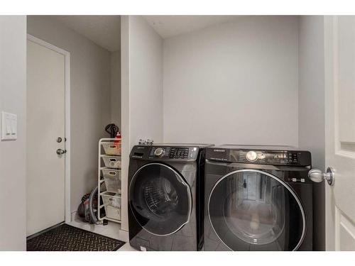 43 Cougarstone Common Sw, Calgary, AB - Indoor Photo Showing Laundry Room