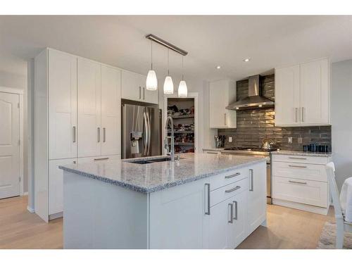 43 Cougarstone Common Sw, Calgary, AB - Indoor Photo Showing Kitchen With Double Sink With Upgraded Kitchen