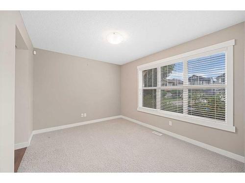 695 New Brighton Drive Se, Calgary, AB - Indoor Photo Showing Other Room