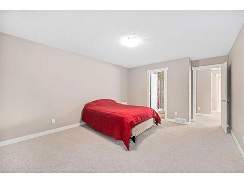 695 New Brighton Drive Se, Calgary, AB - Indoor Photo Showing Bedroom