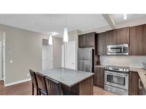 206-4 Sage Hill Terrace Nw, Calgary, AB - Indoor Photo Showing Kitchen With Stainless Steel Kitchen With Upgraded Kitchen