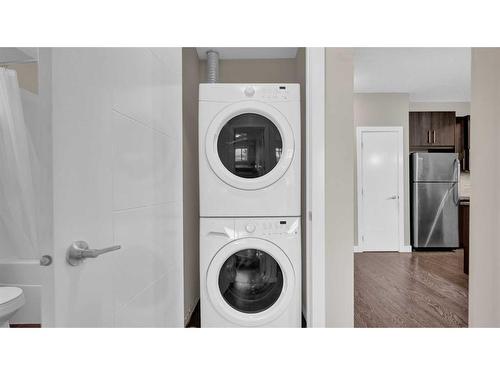 206-4 Sage Hill Terrace Nw, Calgary, AB - Indoor Photo Showing Laundry Room
