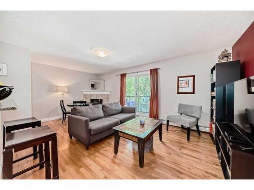 401-1027 1 Avenue Nw, Calgary, AB - Indoor Photo Showing Living Room