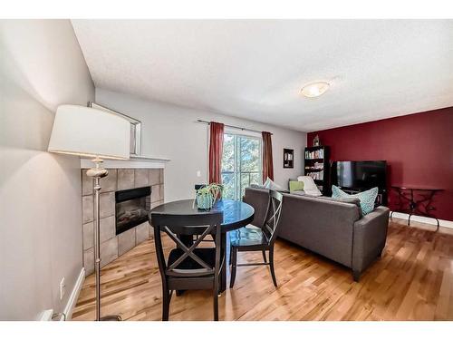 401-1027 1 Avenue Nw, Calgary, AB - Indoor Photo Showing Living Room With Fireplace