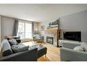 304-835 18 Avenue Sw, Calgary, AB  - Indoor Photo Showing Living Room With Fireplace 