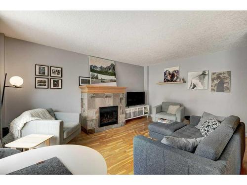 304-835 18 Avenue Sw, Calgary, AB - Indoor Photo Showing Living Room With Fireplace