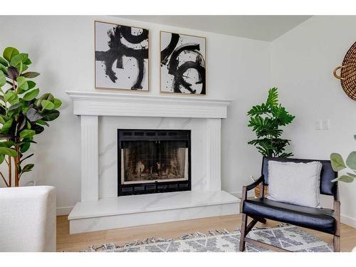 16 Hawktree Close Nw, Calgary, AB - Indoor Photo Showing Living Room With Fireplace