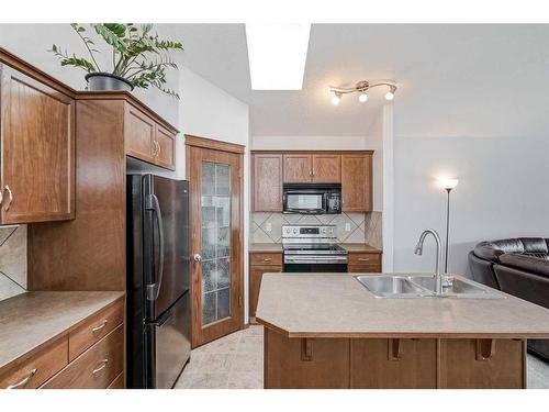 14 Cranberry Close Se, Calgary, AB - Indoor Photo Showing Kitchen With Double Sink