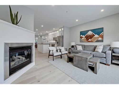 12-11 Scarpe Drive Sw, Calgary, AB - Indoor Photo Showing Living Room With Fireplace