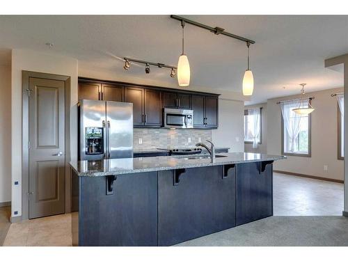 1310-310 Mckenzie Towne Gate Se, Calgary, AB - Indoor Photo Showing Kitchen With Double Sink