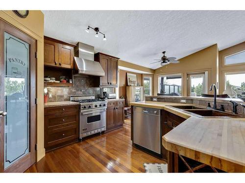 501 High Park Boulevard Nw, High River, AB - Indoor Photo Showing Kitchen With Stainless Steel Kitchen With Double Sink