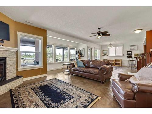 501 High Park Boulevard Nw, High River, AB - Indoor Photo Showing Living Room With Fireplace