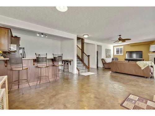 501 High Park Boulevard Nw, High River, AB - Indoor Photo Showing Living Room With Fireplace