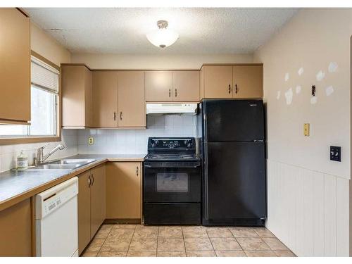 6144 Maddock Drive Ne, Calgary, AB - Indoor Photo Showing Kitchen With Double Sink