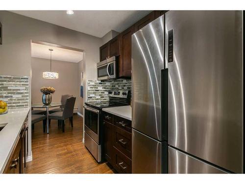 209-819 4A Street Ne, Calgary, AB - Indoor Photo Showing Kitchen With Stainless Steel Kitchen With Upgraded Kitchen