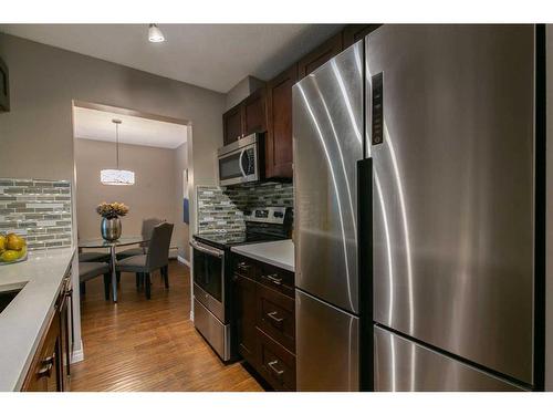 209-819 4A Street Ne, Calgary, AB - Indoor Photo Showing Kitchen With Stainless Steel Kitchen With Upgraded Kitchen