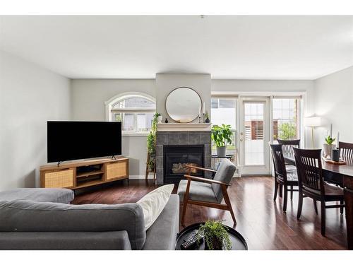 111-923 15 Avenue Sw, Calgary, AB - Indoor Photo Showing Living Room With Fireplace