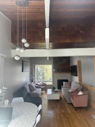 2341 50 Street Ne, Calgary, AB - Indoor Photo Showing Living Room With Fireplace