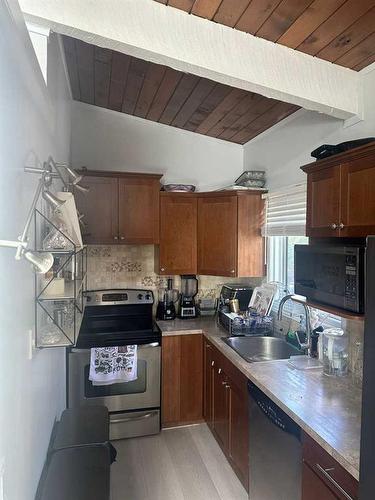 2341 50 Street Ne, Calgary, AB - Indoor Photo Showing Kitchen With Double Sink