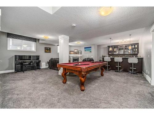 36 Rockyvale Green Nw, Calgary, AB - Indoor Photo Showing Living Room With Fireplace