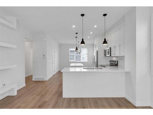 302-72 Cornerstone Manor Ne, Calgary, AB - Indoor Photo Showing Kitchen With Double Sink