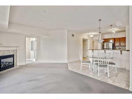 2236-48 Inverness Gate Se, Calgary, AB - Indoor Photo Showing Living Room With Fireplace