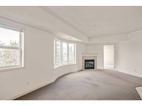 2236-48 Inverness Gate Se, Calgary, AB - Indoor Photo Showing Living Room With Fireplace