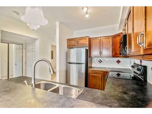 2236-48 Inverness Gate Se, Calgary, AB - Indoor Photo Showing Kitchen With Double Sink