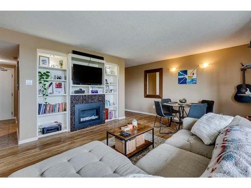 506-429 14 Street Nw, Calgary, AB - Indoor Photo Showing Living Room With Fireplace