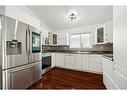 56 Erin Circle Se, Calgary, AB  - Indoor Photo Showing Kitchen With Stainless Steel Kitchen With Upgraded Kitchen 