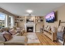 294 Covecreek Close Ne, Calgary, AB  - Indoor Photo Showing Living Room With Fireplace 