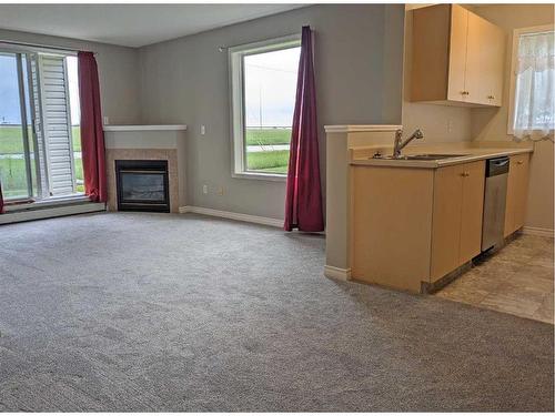 4102-1620 70 Street Se, Calgary, AB - Indoor With Fireplace