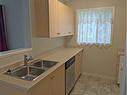 4102-1620 70 Street Se, Calgary, AB  - Indoor Photo Showing Kitchen With Double Sink 